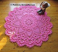 a pink crocheted doily with a cowboy hat on top and the words english df pattern