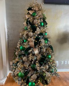 a christmas tree with green and gold ornaments