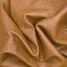 a close up view of a brown leather textured material that is very soft and smooth