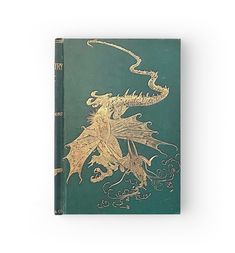 a green and gold book with an image of a dragon on it's cover