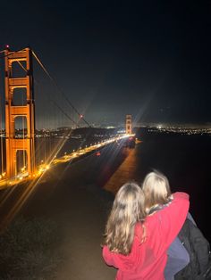 two children looking at the golden gate bridge