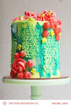 there is a cake decorated with flowers and leaves