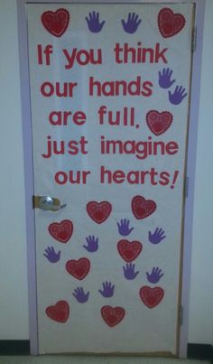 a door decorated with hearts and handprints that says if you think our hands are full, just imagine our hearts