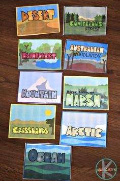 some stickers that are on top of a wooden table with the words australia and other countries