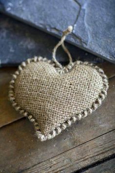 a heart shaped burlock hanging from a string