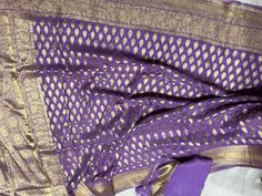 A beautiful , gorgeous Lavender  colour Khaddi georgette pure Banarasi saree with buti  . Pure zari weaving  work all over . Blouse piece zari weaving with border .  *Silk mark certified * Product details :  Material : Silk Georgette  Hand weaved  Pure Zari weaving  Only Dry clean Saree length : 5.5 mt Blouse piece : 80cm ( saree width)  FALL & PICO Tassels : Fall and picot snd tassels complimentary .  Blouse - Available for an additional cost . Let me know . Shipping policy : Dispatch the ready products within the time limit . All my orders shipped through DHL EXPRESS .  Please leave your phone no and email id after order. Baluchari Saree, Lavender Colour, Mirror Work Saree, Georgette Saree With Blouse, Kota Sarees, Banarasi Saree, Georgette Saree, Work Sarees, Handmade Gift Wrap