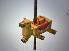 an animal made out of lego blocks hanging from a pole