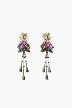 two pairs of earrings with tassels hanging from the ends and beading on each ear