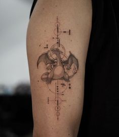 a tattoo on the arm of a person with a bat