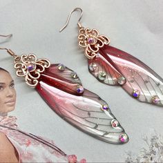 Rose Gold Accent Clear And Charcoal Dropped Earrings. See Through Wings With Gem Decorating The Wing Edges. Crystal Pink And Red Ombr. Pink Sparkles Embedded With Luminescent Iridescent Ab Crystal Rhinestones. Fairy, Fairy Core Or Just Ace Sunshine Favorite, This Would Make An Eccentric Addition To The Most Fairytale Of Outfits! Pink Butterfly Wings, Fairy Kingdom, Pink Sparkles, Gold Flake, Rose Gold Accents, Red Ombre, The Wing, Gold Flakes, Body Chain Jewelry