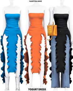 three different colored dresses on mannequins, one with ruffles and the other