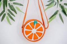 Leather Shoulder bag with fun and original design for children! Genuine leather shoulder bag for children's , in the shape of an orange.  It opens at the top with a zipper. Its straps are safe and adapt to all ages. Its interior is lined  We have two options for orange bags:   *Shoulder bag:Approximate overall diameter of  7.48031 Inches / 19 cm (product is handmade and may vary in cm). and  2.362 pulgadas  / 6cm deep *Mini bag: Approximate overall diameter of  5.90551 Inches / 15 cm (product is Cute Orange Bag For Daily Use, Cute Orange Bags For Daily Use, Cute Orange Travel Bag, Cute Orange Everyday Bag, Cute Orange Everyday Bags, Orange Bags, Orange Backpacks, Orange Design, Genuine Leather Purse