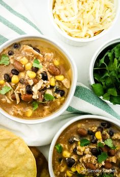 three bowls of mexican chicken soup with tortilla chips and cilantro on the side