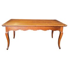 an old wooden table with no one sitting on it's legs or legs, in front of a white background