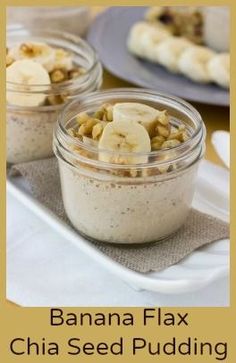 two jars filled with food sitting on top of a table