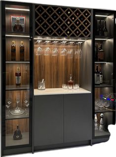 a cabinet with wine glasses and bottles in it