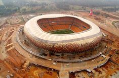 an aerial view of the soccer stadium with construction work on it's roof and surrounding area