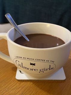 a cup of coffee with a spoon in it