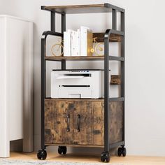 an industrial style shelving unit with wheels and drawers on casteors in a living room