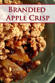 a close up of a plate of food with apples and crumbled toppings