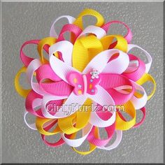 a pink, yellow and white hair bow