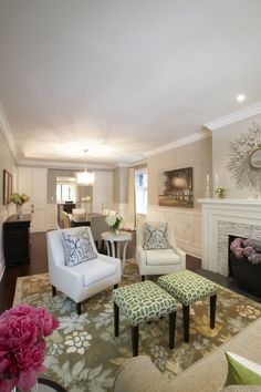 a living room filled with furniture and a fire place