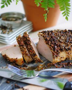 a piece of meat sitting on top of a cutting board