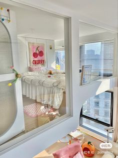 there is a large mirror in the corner of this room that has been decorated with pink and white furniture