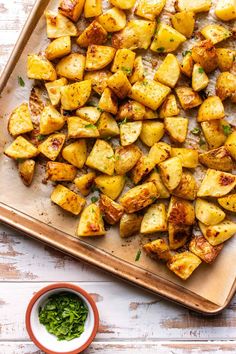 roasted potatoes with herbs on a cutting board