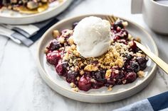 two plates filled with dessert on top of a table