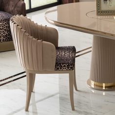 an elegant dining table with leopard print upholstered chairs