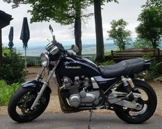 a black motorcycle parked on the side of a road