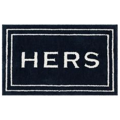 a black door mat with the word herbs on it and white letters that spell hers