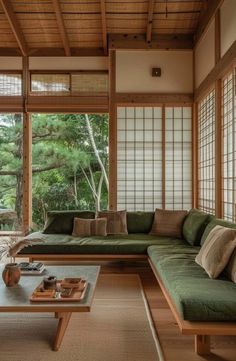 a living room filled with furniture and lots of windows