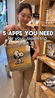 a woman is holding a purse in her hand and looking at it with the words 5 apps you need for your japan trip part 3