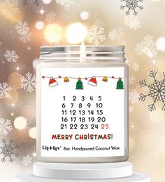 a jar with a calendar on it sitting in front of snowflakes and lights