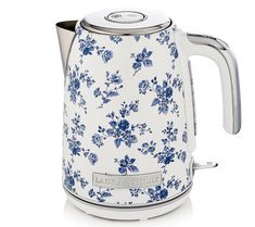 a blue and white floral tea kettle on a white background