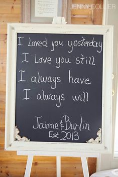 a chalkboard sign with writing on it