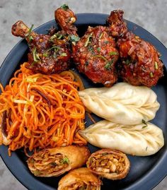 a black plate topped with different types of food