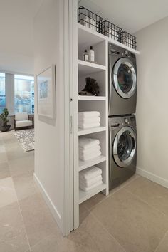 a washer and dryer in a white laundry room