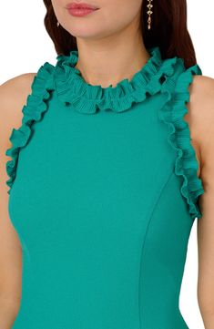 Romantic ruffles flutter at the top of this sophisticated fit-and-flare designed with handy pockets and a knee length. 37" length (size 8) Hidden back-zip closure Crewneck Sleeveless Side-seam pockets Lined 98% polyester, 2% elastane Dry clean Imported Fitted Sleeveless Dress With Scalloped Edges, Sleeveless Cocktail Ruffle Dress, Green Sleeveless Ruffled Knee-length Dress, Chic Green Sleeveless Dress With Ruffles, Fitted Sleeveless Pleated Ruffle Dress, Fitted Sleeveless Ruffle Dress With Pleats, Fitted Midi Sleeveless Dress With Ruffles, Flirty Sleeveless Ruffle Dress, Sleeveless Pleated Ruffle Dress For Party