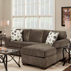 a living room scene with focus on the couch and coffee table in the foreground