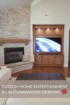 a living room with stone fireplace and built - in entertainment center is featured for autumnwood designs