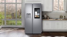 a large silver refrigerator freezer sitting inside of a kitchen