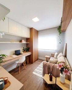 a living room filled with furniture and lots of plants on top of the shelves next to a window