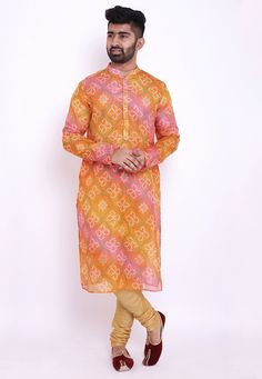 Readymade Art Kota Silk Kurta in Shaded Orange and Pink. This Collar Neck and Full Sleeve attire is Prettified with Buttons and Bandhej Print and has Two Side Pockets. Do note: Bottom and Footwear shown in the image is for presentation purposes only. Half to one inch may vary in measurement. (Slight variation in actual color vs. image is possible). We sell all kinds of menswear. Mens Kurta | Mens Kurta Pajama | Mens Sherwani | Mens Sherwani Sets | Traditional Menswear | Partywear Menswear | Indi Bandhej Print, Mens Kurta Pajama, Indian Jackets, Mens Sherwani, Mens Kurta, Party Mode, Nehru Jacket, Orange Ombre, Silk Kurta