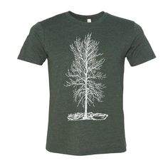 "This lightweight crew neck unisex / men's tshirt features an image titled Solitude, it's a Single Bare Tree in the Winter that's screen printed by hand in eco-friendly ink. I personally hand draw each of my unique designs. I expose the art onto a traditional silk screen. Then I screen print each piece by hand with love in my home studio. It's a workout! Ink color (white or black) is as shown in each sample picture and is based on what looks best for the particular graphic and t-shirt color combination. I use eco-friendly, water based inks. They don't require chemicals for clean up. And the screen print design lasts forever, through many, many washes and wears! The tee shirt is made from soft, lightweight fabric and is a comfortable, roomy style. I purchase from suppliers like Bella and Ca Eco Print Scarf, Tree T Shirt, Tree Winter, Winter Tree, Bare Tree, Hand Draw, Screen Printing Designs, Winter Trees, Winter Solstice