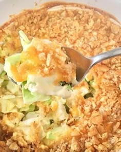 a white bowl filled with food and a spoon