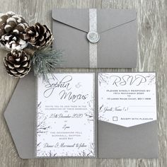 wedding stationery with pine cones and silver ribbon