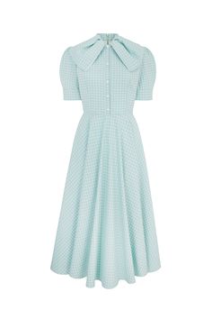 Inspired by a 1940s vintage archive piece, the Allison dress is cut from a high quality mint green two-tone gingham textured cotton. A soft mint green shade, Allison is a beautifully chic dress for special occasions.The dress has a semi-fitted bodice, lined with soft viscose, and featuring contrast white covered buttons. The full fluid skirt falls elegantly to a long midi length, the structured short sleeves are finished with a neat cuff. The stand collar has a beautiful bow-effect draped neckli Suzannah London, London Boutique, Boutique Couture, Long Midi, Dress Mint, Draped Neckline, Invisible Zip, Fall Skirts, Buckle Belt